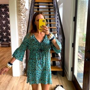 Teal animal print dress with ruffled collar and bell sleeves.  By Mud Pie, Sz S